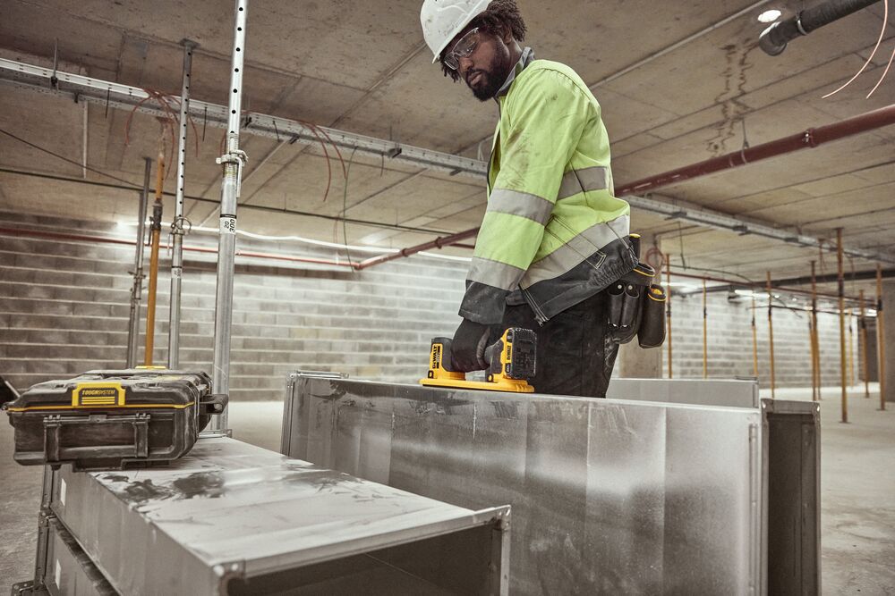 User lifting HVAC duck with DEWALT® 20V MAX* Grabo Lifter