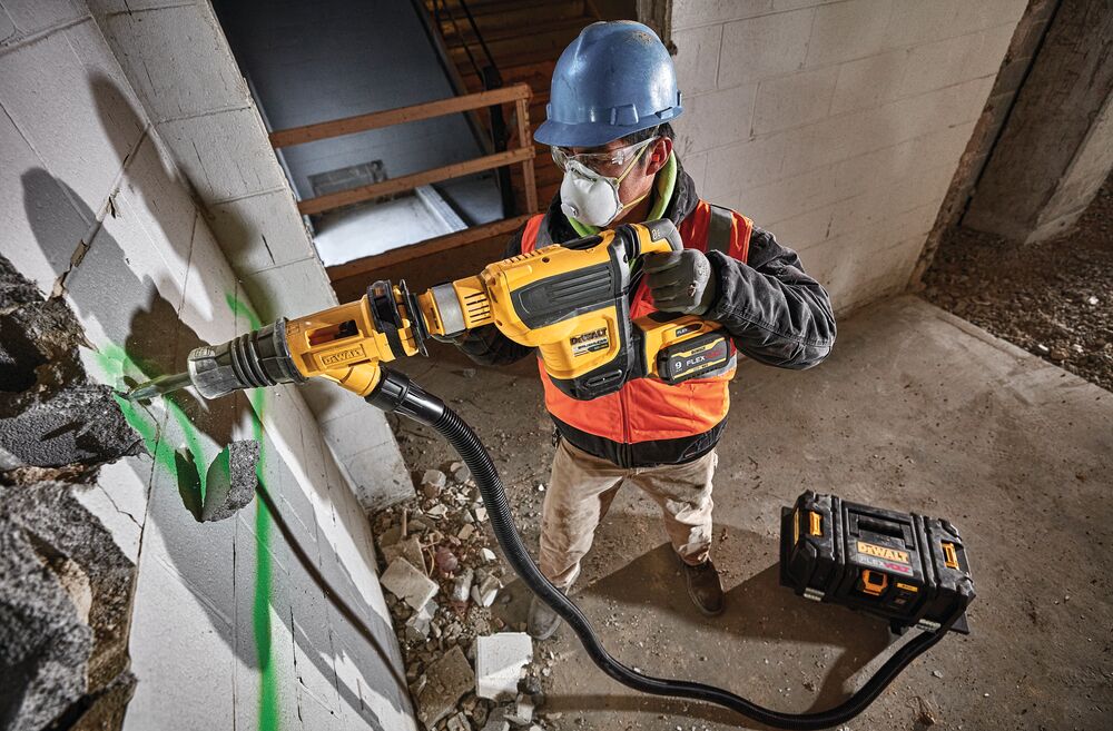 Brushless, cordless SDS MAX combination rotary hammer being used by a person