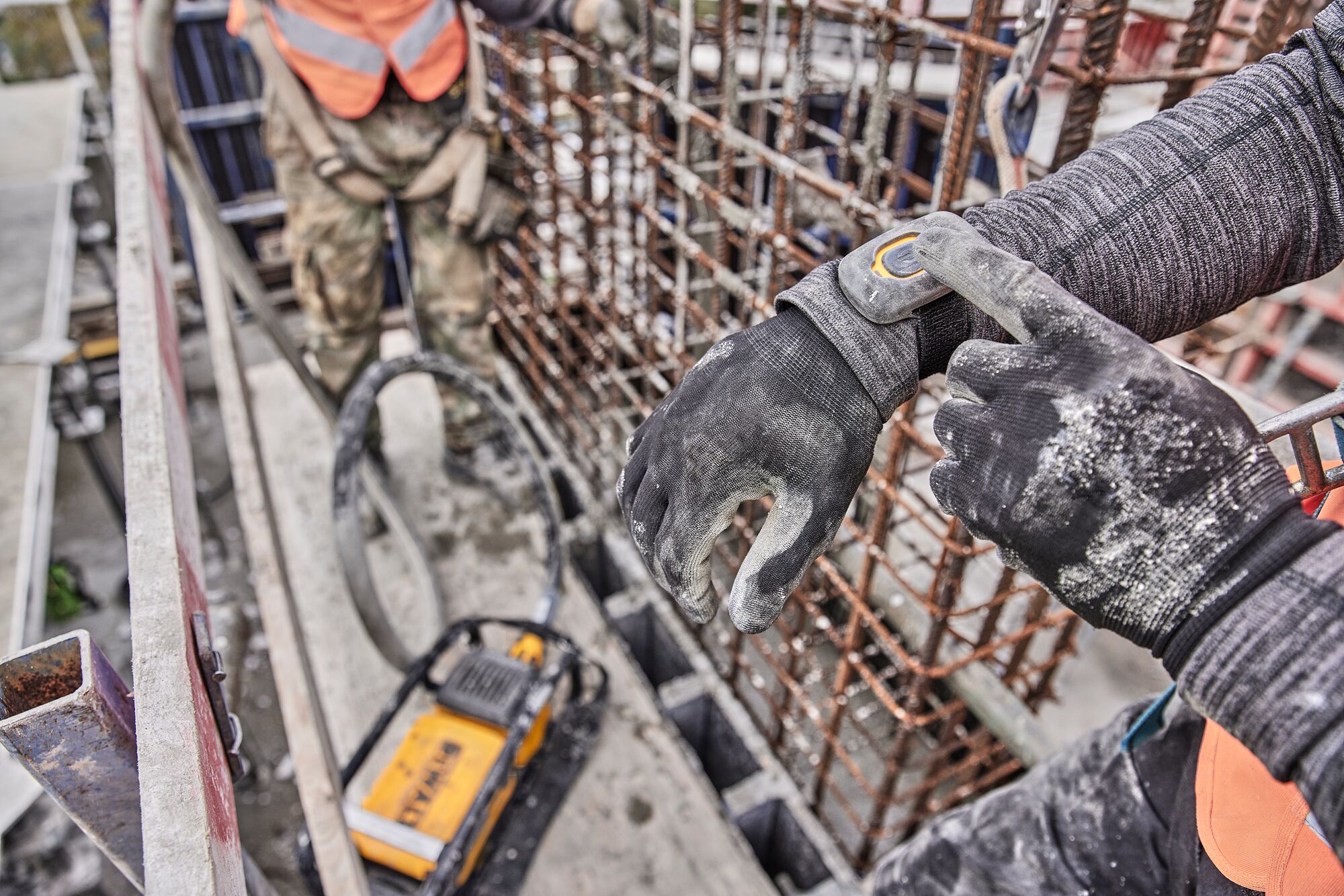 Man turning vibrator on using wireless tool control™ remote