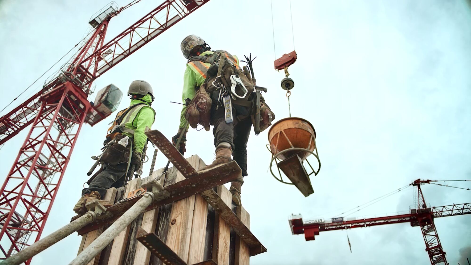 Two concrete masons on the jobsite
