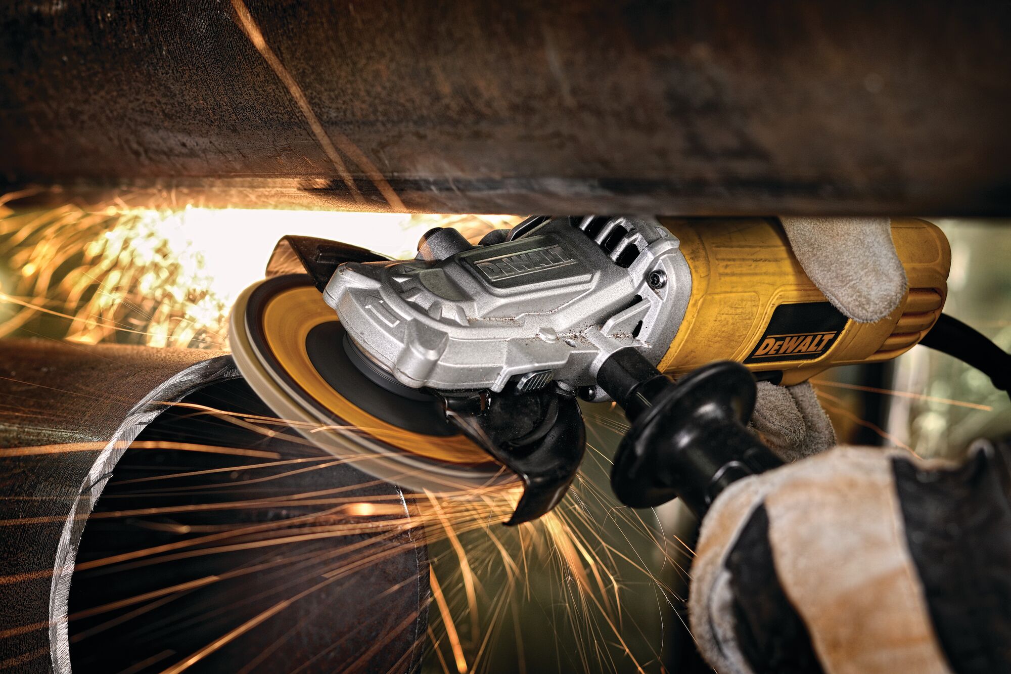 Flathead paddle switch small angle grinder with nolock on being used to grind metal.