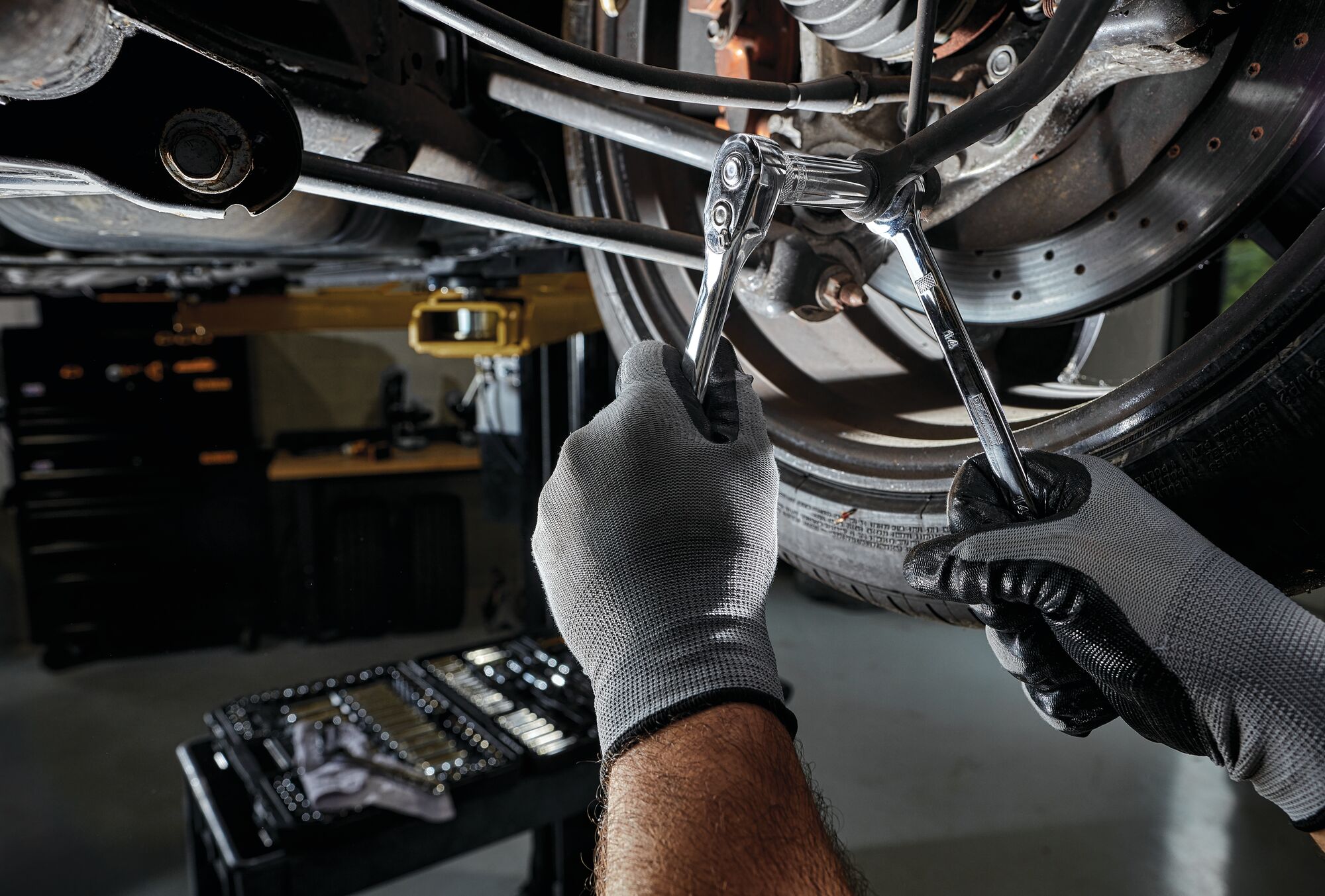 227 piece DEWALT mechanics tools set being used by a person.