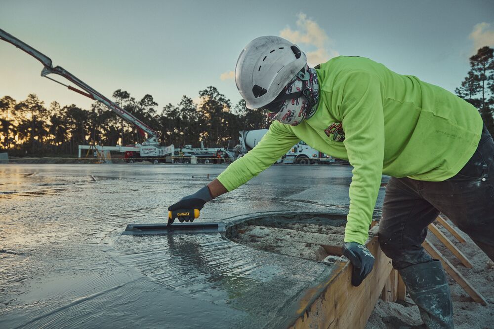 DEWALT hand trowel smoothing concrete wall